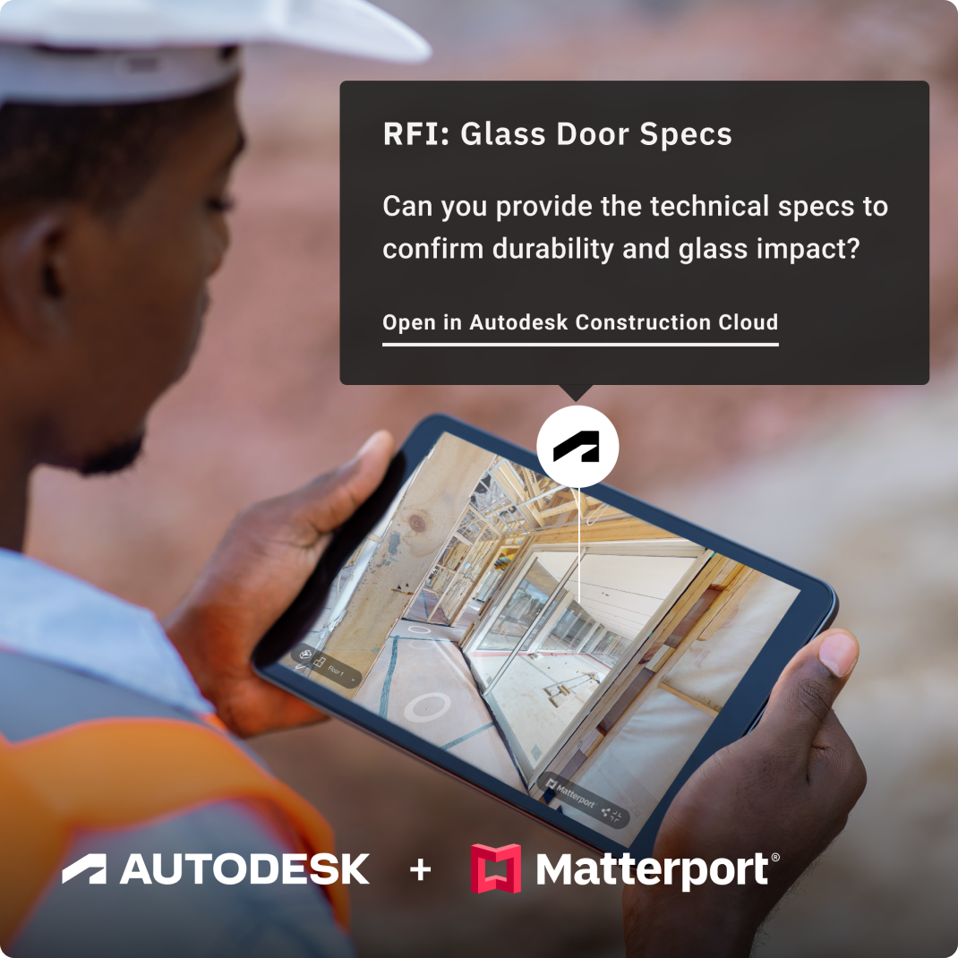 A construction worker looking at a Matterport model on a tablet