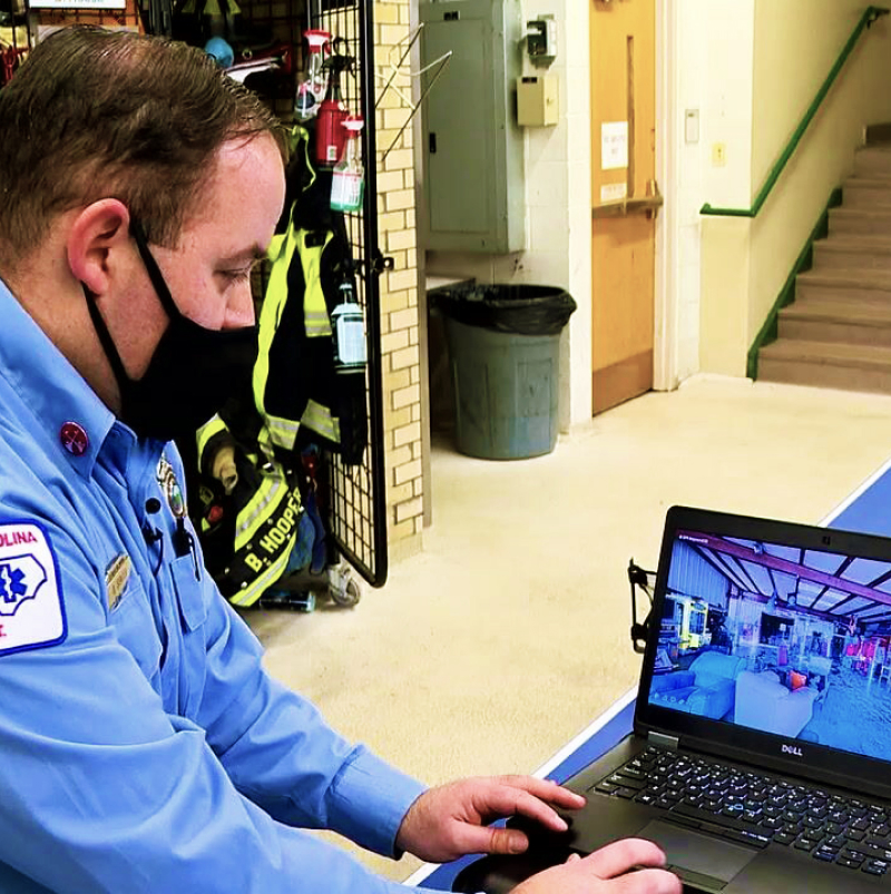 Public safety worker working on laptop