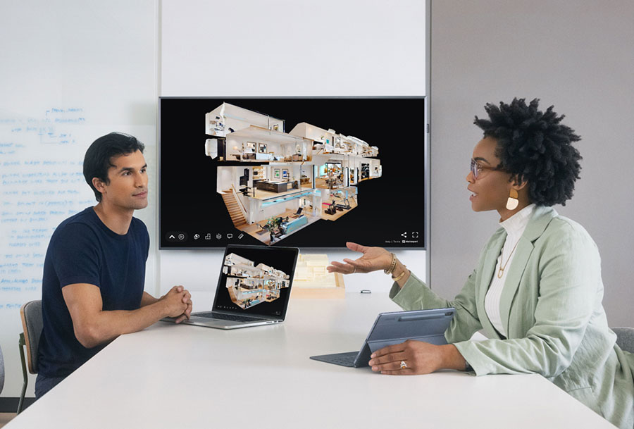 Two employees talking in a conference room