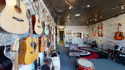 Pine Cone Music Studio Interior featuring a wall of guitars